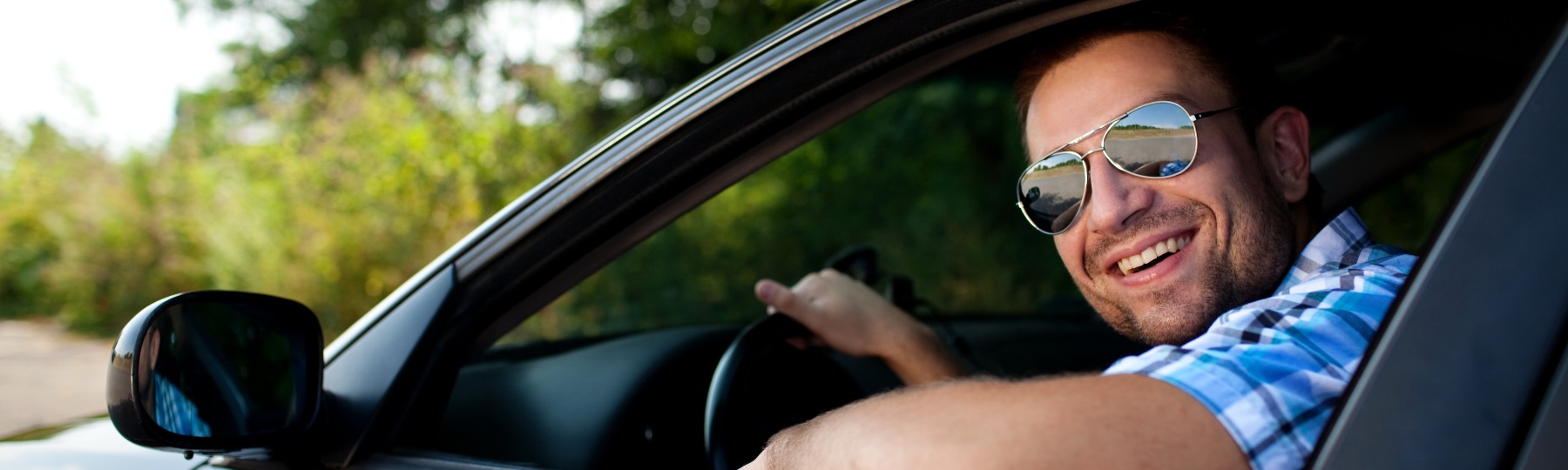 Guy in car for auto insurance